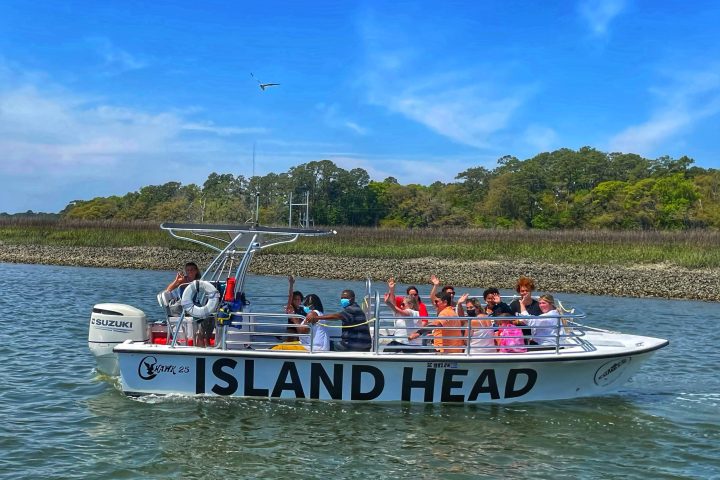 a group of people on a boat in a body of water