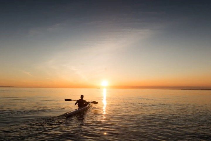 a sunset over a body of water