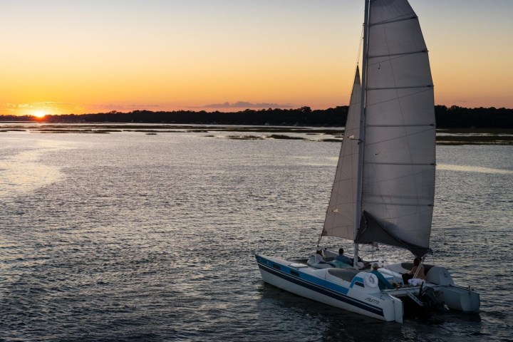 a boat traveling along a body of water