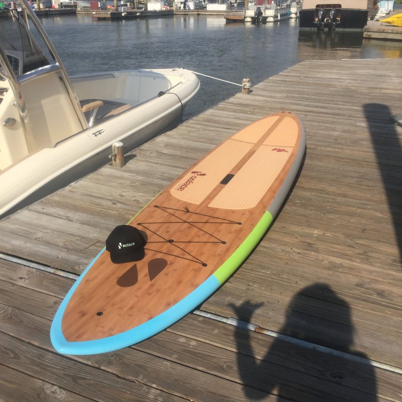 A paddle board on the deck of the doc