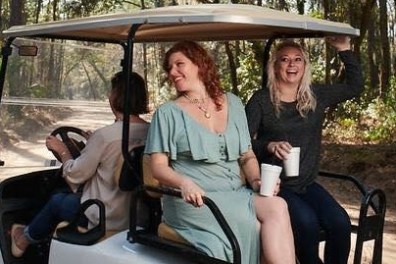 a man and a woman sitting on a bench