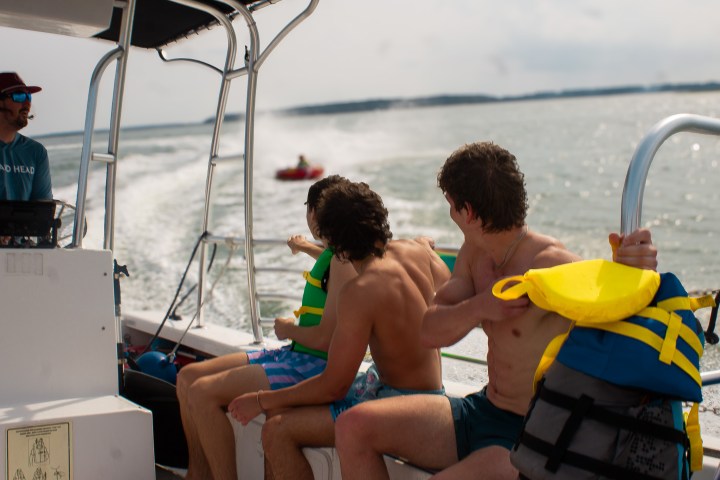 a man sitting on a boat in the water