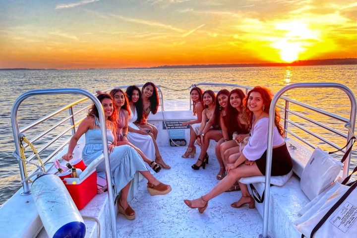 a group of people sitting at a beach