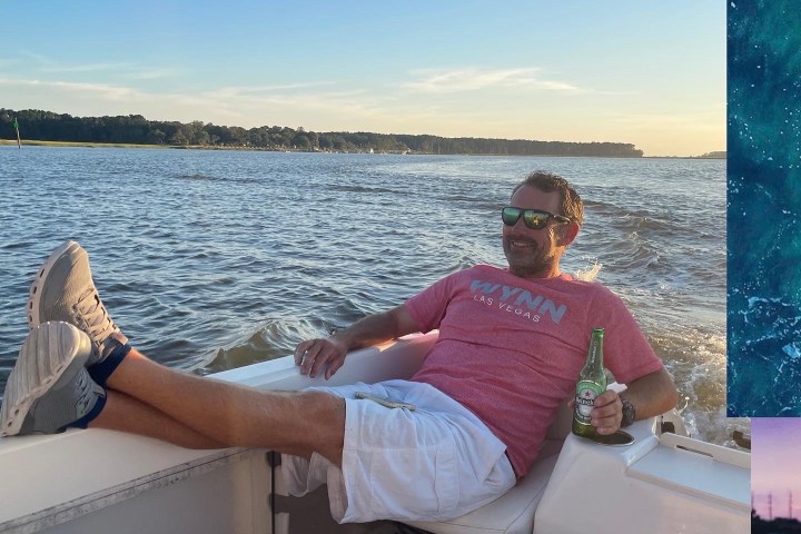 a man and a woman standing next to a body of water