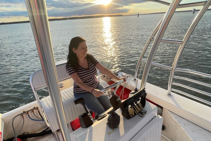 a person sitting on a boat in the water