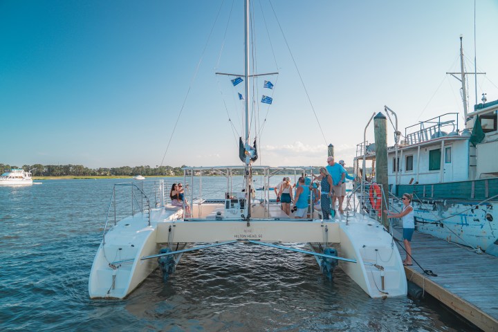 a boat is docked next to a body of water