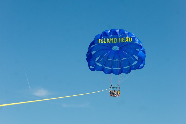 a parachute in the middle of a clear blue sky